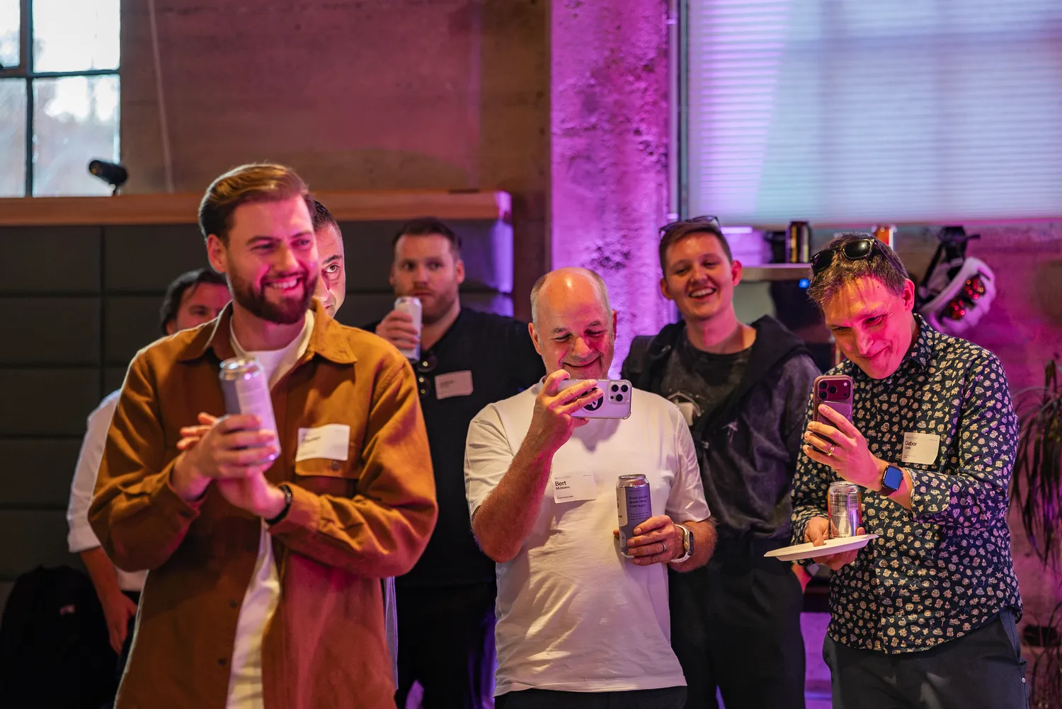Guests laughing and filming during the aftershow